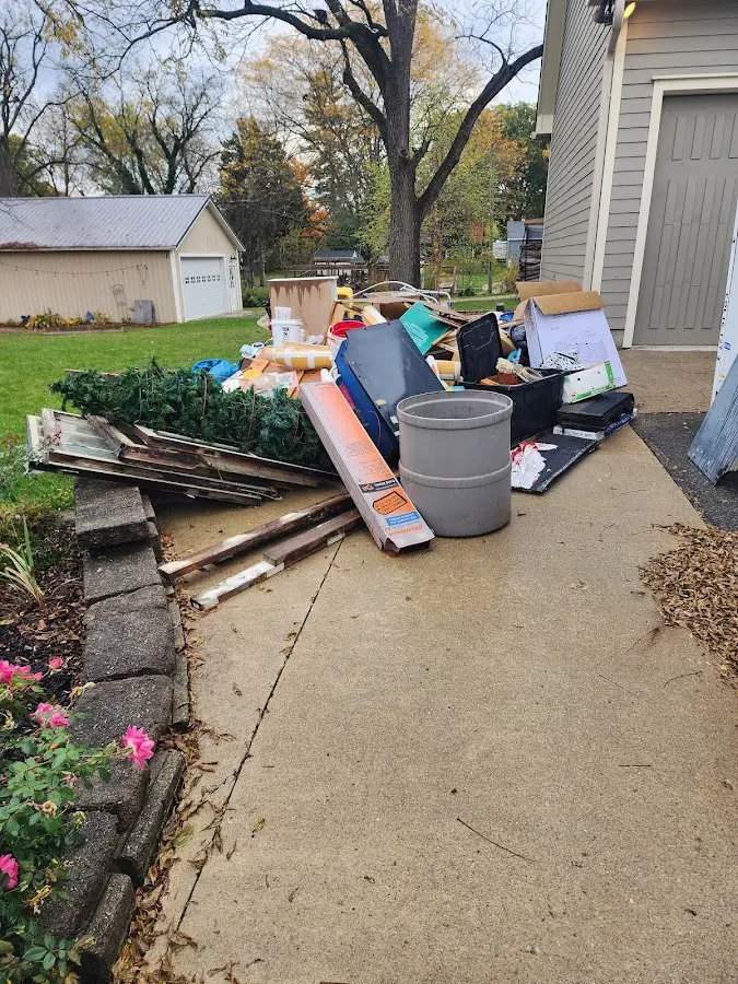 Dumpster being loaded with debris for Demolition Dumpster Rental in Lake of the Pines